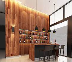 This contemporary home bar found an unlikely neighbor in a stylish exercise room with a graphic wall that adds to the general look of both rooms. Design A Home Bar In 8 Easy Steps
