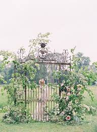 The Most Beautiful Entrance An Old Iron Gateway Decorated With Flowers Wedding Sparrow The Summer Editorial Garden Entrance Wedding Sparrow Outdoor Wedding