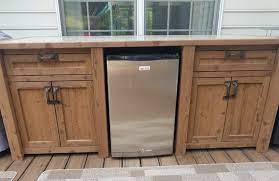Not only is the mini fridge cabinet totally gorgeous, but oh so functional too! Free Shipping Outdoor Beverage Bar With Cooler And Mini Fridge In 2021 Outdoor Mini Fridge Outdoor Patio Bar Outdoor Kitchen Cabinets