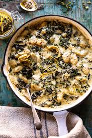 Skillet Baked Creamy Pesto Spinach And Artichoke Gnocchi Half Baked Harvest Recipe Pesto Spinach Half Baked Harvest Recipes Harvest Recipes