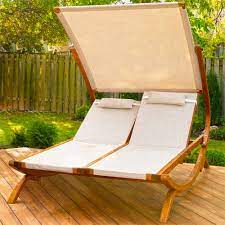 Even cramped spaces can benefit from having two small folding chairs and a patio table for holding drinks or a good book. Amazon Com Leisure Season Drl7157 Double Reclining Lounge Chair With Canopy Brown 1 Piece Wood Chaise Patio Furniture Outdoor Bench Lawn Chairs With 2 Pillow Cushions For Pool