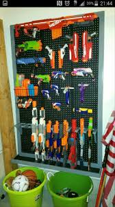 The gun holders are acoustic foam tiles, cut to fit and the shelves are lined with thick, tool box drawer liners (to prevent the guns from. Nerf Gun Storage