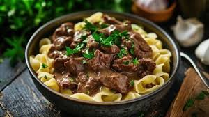Tender strips of beef and mushrooms in an creamy Stroganoff sauce ...