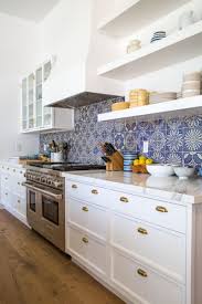 Modern White Kitchen Open Shelving Blue Patterned Tile Backsplash Da Kitchen Backsplash Designs Kitchen Cabinet Design Kitchen Backsplash Tile Designs