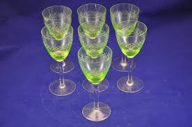 The relationship between a piece of glass's propensity to glow and its uranium content is often not predictable. 7 Wine Glasses Uranium Glass Around 1920 Buy At Kusera