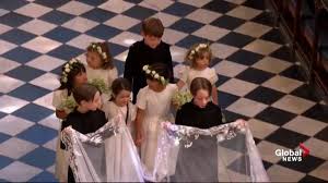The photo sees prince harry holding his baby boy in his arms during the. Smiling Page Boy Photobombs Meghan Markle At Royal Wedding National Globalnews Ca