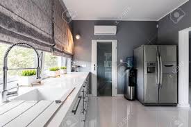 big windows, elegant kitchen units