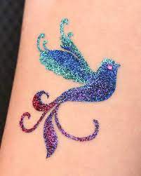 Glitter tattoos are the hottest form of temporary body art in the world today and are a fun way to entertain guests of all ages at parties and special events. Lainetoo Custom Fancy Bird Temporary Glitter Temporary Tattoo Glitter Tattoo Tattoos Body Art