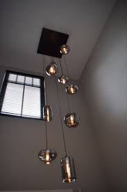 hanglamp by eve creeer sfeer op grote hoogte colijn interieur hal verlichting huis verlichting trappenhuis decoratie