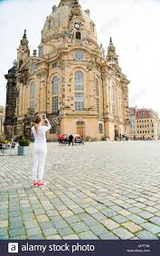Download This Stock Image Girl Makes Photos Shots Of European City Dresden And Selfie Of Background Old German Make Photo Village Photography Stock Photo Girl