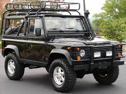 Land Rover Defender 90 Soft Top In Black With Pull Cable Fishing Rack Surf Board Rack And Utility Lights Land Rover Defender Land Rover Defender 90