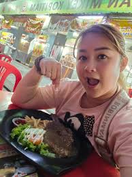 Mickie Kam Siew Leng added a new...