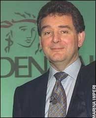 Man from the Pru happy under his brolly