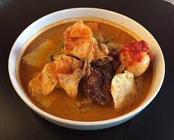 Rice is rolled inside a banana leaf and boiled, then cut into small cakes as a staple food replacement of steamed rice. The Champion Lontong Sayur Picture Of Medan Ciak Sydney Tripadvisor