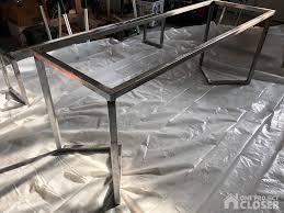 The table frame fittings and pipe were treated with toilet bowl cleaner in order to age the metal and give it a more distressed look. Diy Modern Dining Table Plans Tutorial