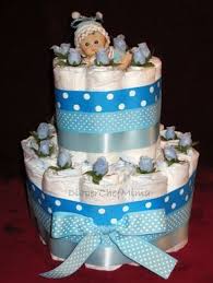 Diaper cakes can be a fun baby shower centerpieces. Pin On Baby Shower