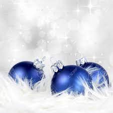 A christmas wreath decorated with blue white, silver and chocolate ornaments looks very elegant and very chic. Christmas Or Holiday Background With Blue Silver Ornaments On Billowy Feathers Stock Photo Picture And Royalty Free Image Image 33928871