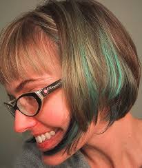 For dimension, movement and a stylish finish, consider featuring short brown hair with highlights. 14 Beautiful Blue Hair Streaks For Women