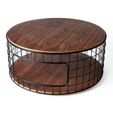 A round coffee table with a very distinct, traditional look, which hides a set of four little stools underneath when not in use! Gus Wireframe Coffee Table