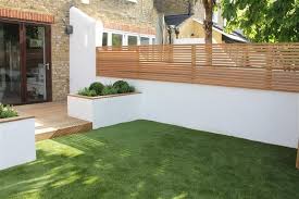 Cedarwood Astroturf And White Rendered Walls For An Easy To Maintain Tiny London Garden Backyard Garden Design Modern Garden Contemporary Garden Design