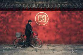 午后 午后推着自行车载着宠物悠闲走过文殊院的老人斑驳的光影洒向墙面构成一幅有趣的画面 photo travel photography frequent flyer miles