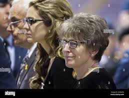 Edith McQueen, the mother of Capt. Thomas McQueen, enters the funeral  service for her son with her husband, Tom McQueen, and her son's fiancee,  Caitlin Skelhorn, during the funeral service for Canadian