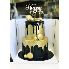 Get cake ideas for him, men and boys. Black And Gold Two Tier Cake Birthday Cake For Him Tiered Cakes Birthday Drip Cakes