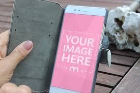 Mockup Featuring A Woman Holding A White Android Smartphone In Hand On A Wooden Desk Background A Perfect Mock Android Smartphone Smartphone Smartphone Repair