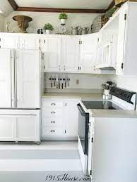 The stained knotty alder has texture and subtle color differences due to the knots but it is. From Knotty Alder To Light Grey Kitchen Cabinets Sawdust Sisters