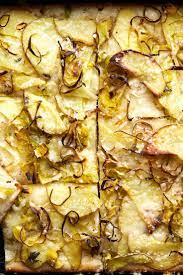 Nyt Cooking Tender Yukon Gold Potato Slices And Crispy Leeks Top A Fluffy Slab Of Long Risen Dimpled Focaccia For In 2021 Vegetarian Main Dishes Nyt Cooking Cooking