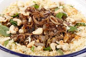 Heat 1 tbsp of oil in a big frying pan. Spicy Moroccan Style Minced Beef Served With Couscous Mixed With Chopped Herbs And Dried Apricots Garnished With Toasted Cashew Nuts And Almond Slivers And Topped Off With Fried Onions Stock Photo Picture