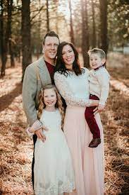 Family Of Four Posed With Gorgeous Coordinating Outfits Pinks And Reds Wide Aperture Fam Family Portrait Poses Family Picture Poses Fall Family Photo Outfits