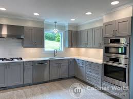 The glass cabinetry features antique german glass, the textured glass with its appealing irregularities within adds a beautiful watercolor effect to objects stowed within. Gray Kitchen By Charo Hunt Cabinet World Of Pa