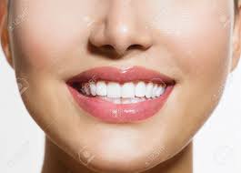 Practicing good dental hygiene not only keeps breath smelling fresh and a smile looking bright, but it also helps prevent tooth decay and other complications. Healthy Smile Teeth Whitening Smiling Young Woman Stock Photo Picture And Royalty Free Image Image 21386739