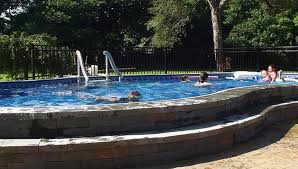 Semi Inground Swimming Pool With Stone Deck Backyard Pool Landscaping Semi Inground Pools Inground Pools
