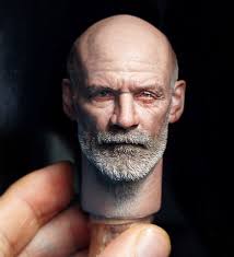 Hey everyone. Just wanted to show off this work in progress of a 1/12th  movie concept Lobster Johnson figure I'm making. The head is actually a  Thomas Haden Church sculpt underneath there!