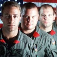 US Air Force STAFF Sergeant Steve Mackin and US Air Force Captain Roy Dileo  tape a patients head protection device at at Lackland Air Force Base,  Texas's, Wilford Hall Medical Center. This