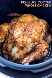 A Whole Chicken Covered With Olive Oil And Flavorful Spices Stuffed With Onion An Pressure Cooker Recipes Chicken Pressure Cooker Chicken Multi Cooker Recipes