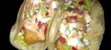 To serve the tacos, either flake the fish and serve family style alongside the slaw and any additional toppings, or build the tacos by adding some slaw and some fish to each tortilla. Fish Tacos Ultimo