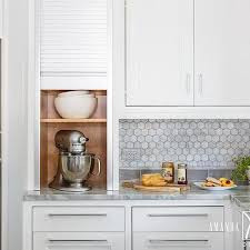 Instead of placing the rolling covers in a vertical orientation, typical of past works, the slats are installed horizontally. Kitchen Appliances Roll Up Cabinet Design Ideas