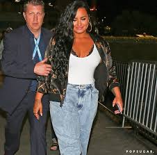 Our best going out looks. Demi Lovato S Cute Super Bowl Outfit With Jeans And Sneakers Popsugar Fashion