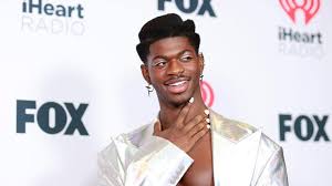 Lil nas x strokes a fake baby bump while announcing he's 'pregnant' with debut album in jaw dropping video. Mrbm8yllexythm