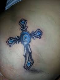If your cross tattoo is just for symbolic purposes, a wooden cross surrounded by stones or rocks like this one will do. 51 Evil Eye Tattoos