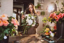 How to care for flowers from florist. Free Photo Woman Florist At Her Own Floral Shop Taking Care Of Flowers