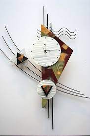 This Contemporary Metal Wall Clock Sculpture Is A Great Design With Clean Lines And Makes A Great Look On Any Clock Wall Art Clock Art Abstract Metal Wall Art