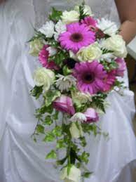 Woodbridge, va florist | brandon's flowers provides same day flower delivery on stunning flower arrangements for all occasions, celebrate florals with bouquets, long stem roses, garden roses, birthdays, mothers day, love and romance, funeral flowers, sympathy, prom flowers, plants, dish gardens, and much more in woodbridge, va 22191, and surrounding areas! Cascading Bridal Bouquet Of White Roses Pink Roses Pink Gerber Daisies White Daisies And Varig Cascading Bridal Bouquets Bridal Party Flowers Wedding Boquet