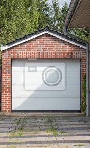 Feldmann produziert und montiert hochwertige garagentore für renovierungsvorhaben und neubauten nach maß.feldmann garagentore. Gemauerte Garage Mit Weissem Tor Fototapete Fototapeten Carport Einbaum Garage Door Myloview De