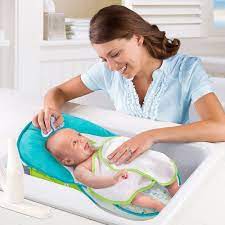 Our son takes his first bath. Toys R Us Bath Seat Cheap Online