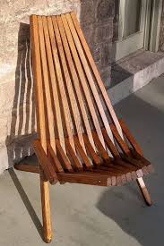 This Art Nouveau Style Of Adirondack Chair Is Handcrafted From Sturdy Kiln Dried Yellow Pine Starting With S Handcrafted Chair Outdoor Furniture Patio Chairs