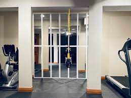 A few crucial pieces of equipment and buy a gym mirror, and then your gym is ready. Diy Mirror Wall Home Gym On A Dime Tami In Between